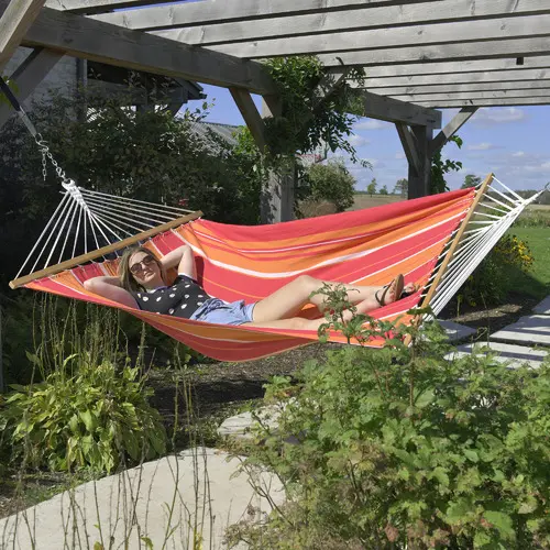 Oversized woven cotton hammock with wooden spreader bars