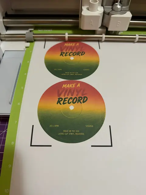 Lathe-cut vinyl single pressed in a hardwood jacket