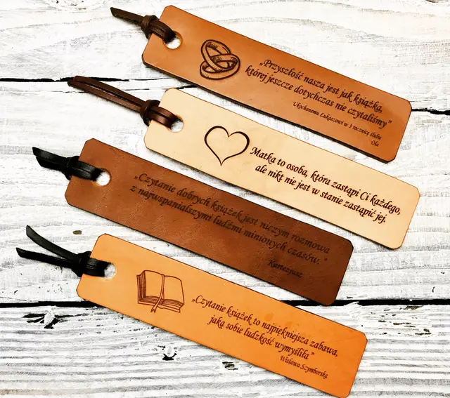 Leather bookmark paired with a handwritten anniversary itinerary card