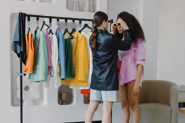 Personal stylist helping a client choose accessories in a boutique