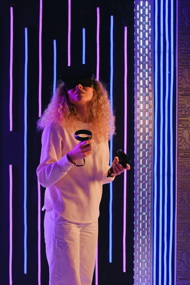 Woman playing a VR headset game - VR escape room experience