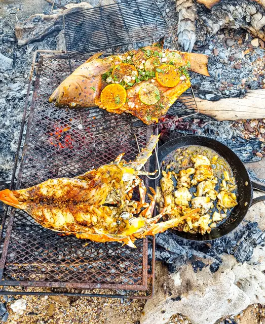 Catch-and-cook beach campfire feast
