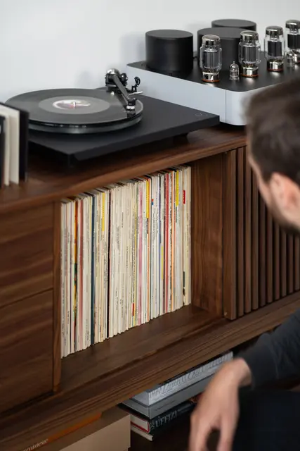 Minimalist wooden turntable for shared record collection