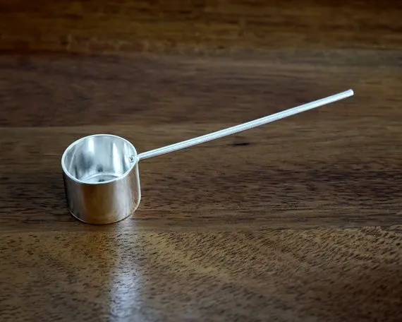 Silversmith-crafted coffee measuring scoop