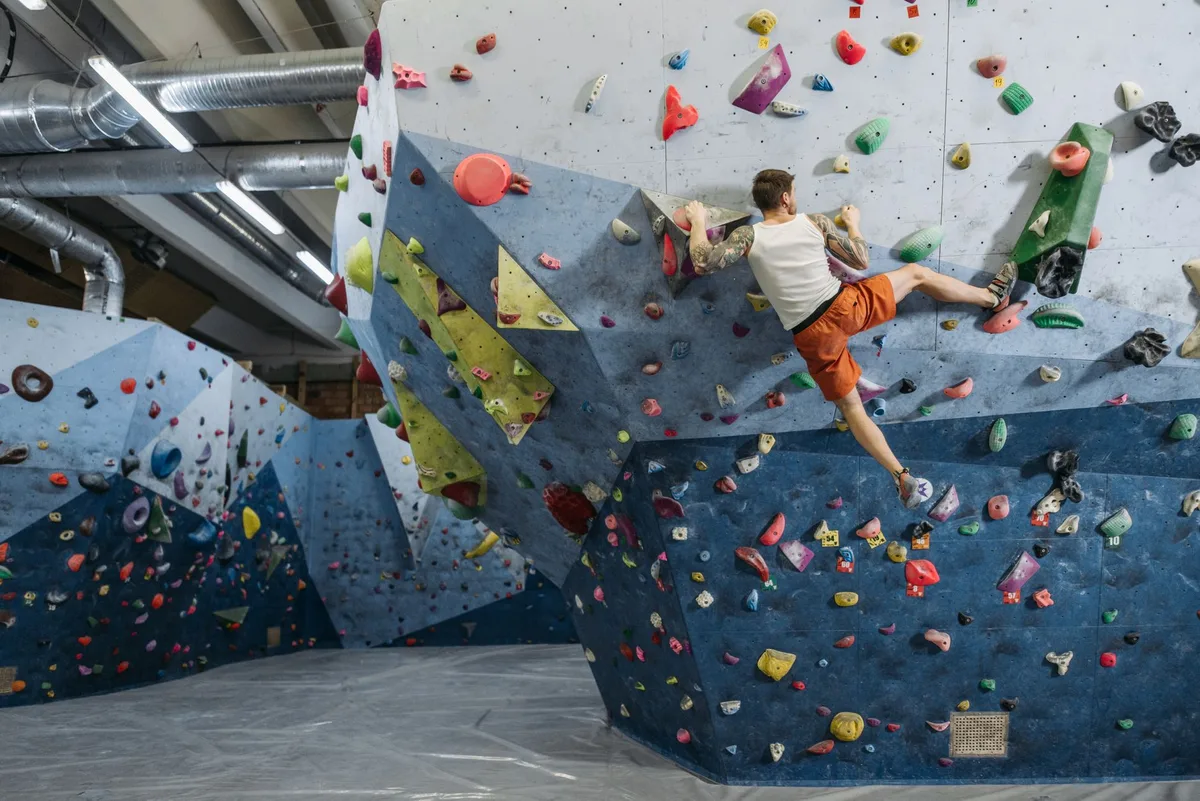 Kids at an indoor rock climbing wall