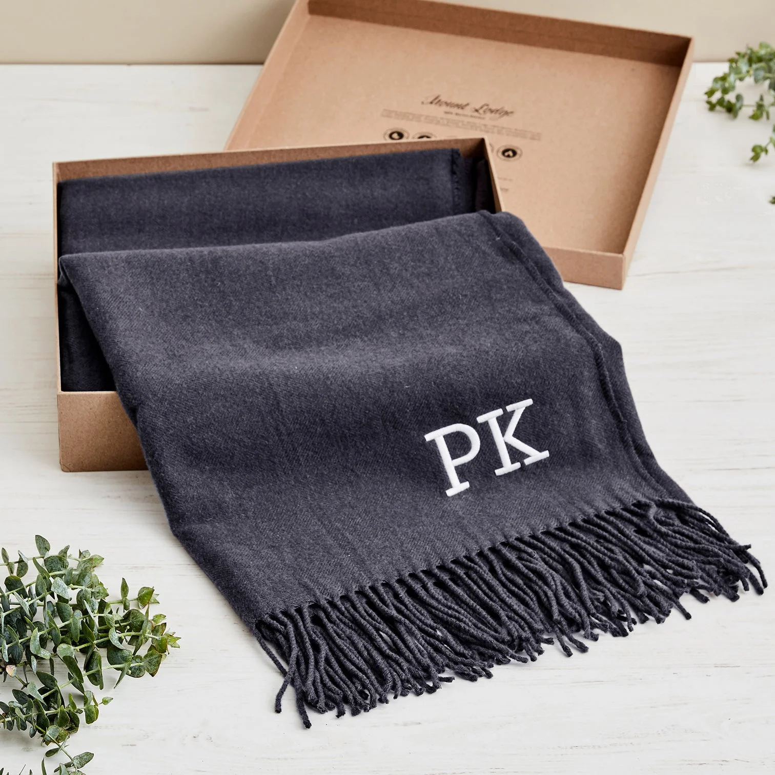 Custom embroidered Australian merino wool blanket with crimson initials