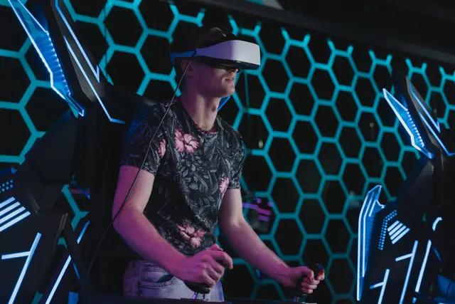 Man playing a virtual reality game in an arcade setting
